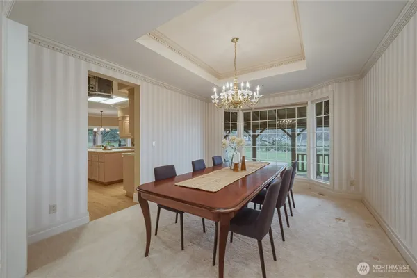 a view of a dining room with furniture window and chandelier