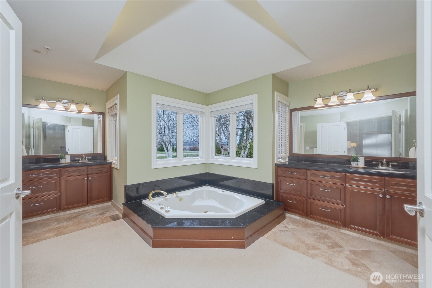 7349 Old Guide Road Ferndale, WA 98248 - Photo 18 of 40 a bathroom with a granite countertop tub sink and mirror