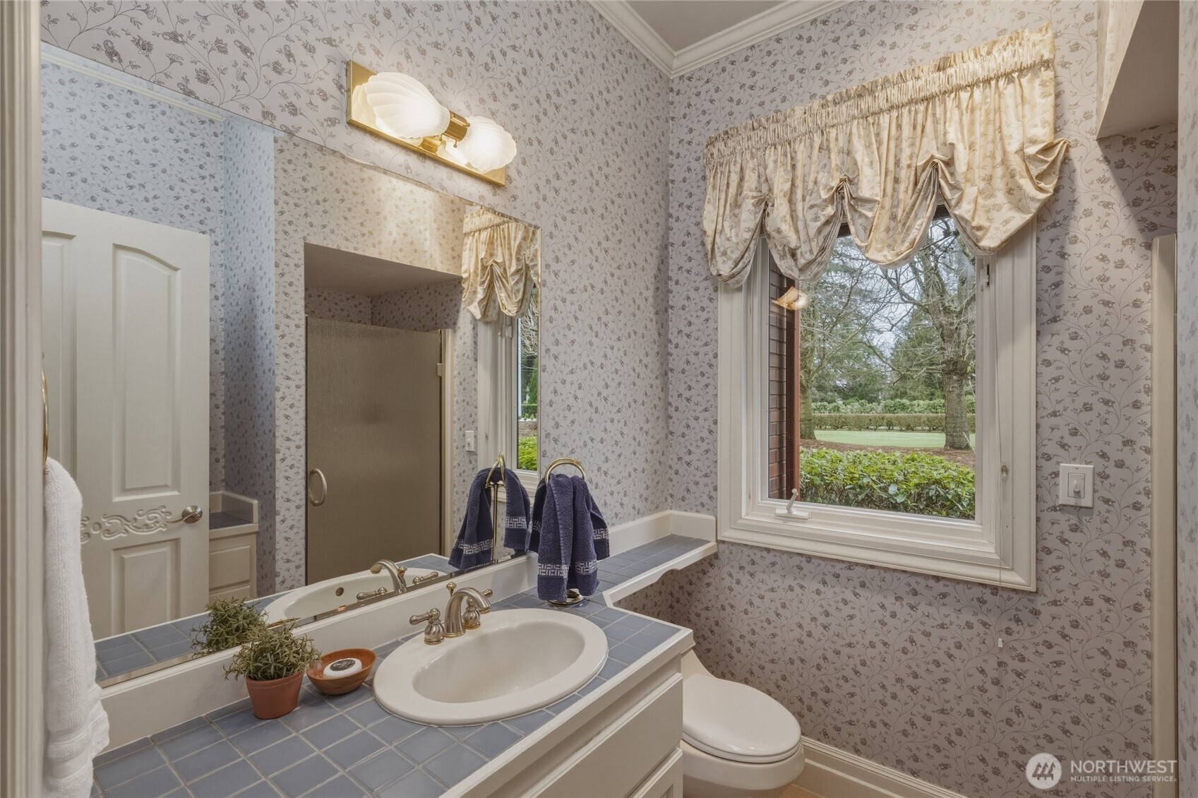 7349 Old Guide Road Ferndale, WA 98248 - Photo 22 of 40 a bathroom with a sink toilet a mirror and shower