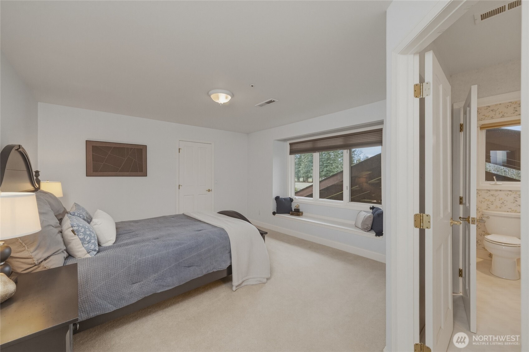 7349 Old Guide Road Ferndale, WA 98248 - Photo 25 of 40 a bedroom with a bed and a large window