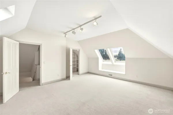 a view of a big room with window and cabinet