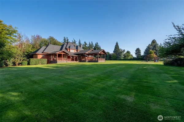 a view of a house with a big yard
