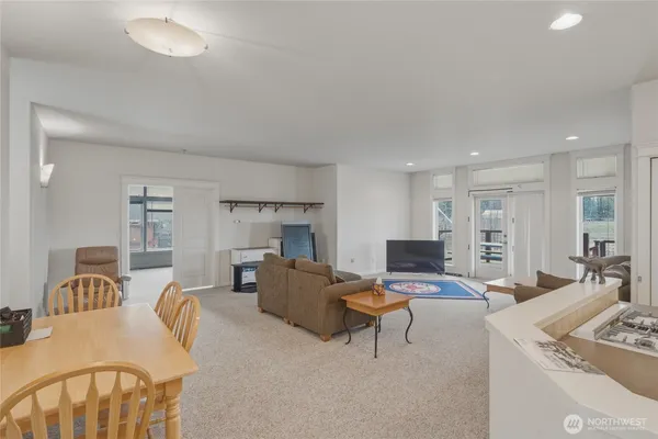 a living room with furniture and flat screen tv