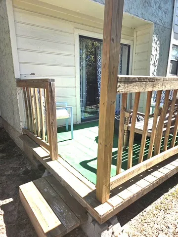 a view of a balcony with a floor to ceiling window