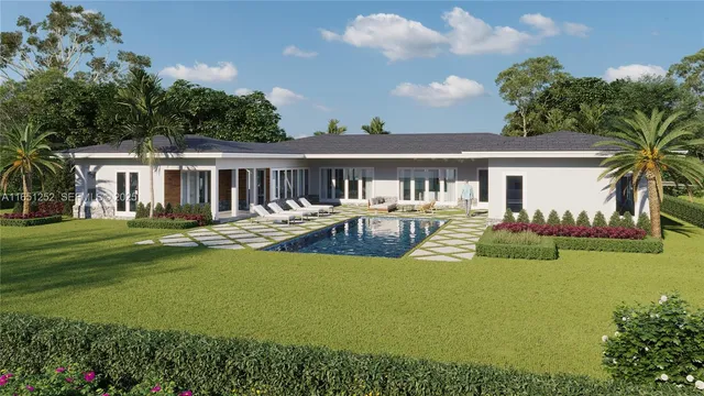 a view of a house with swimming pool and a yard