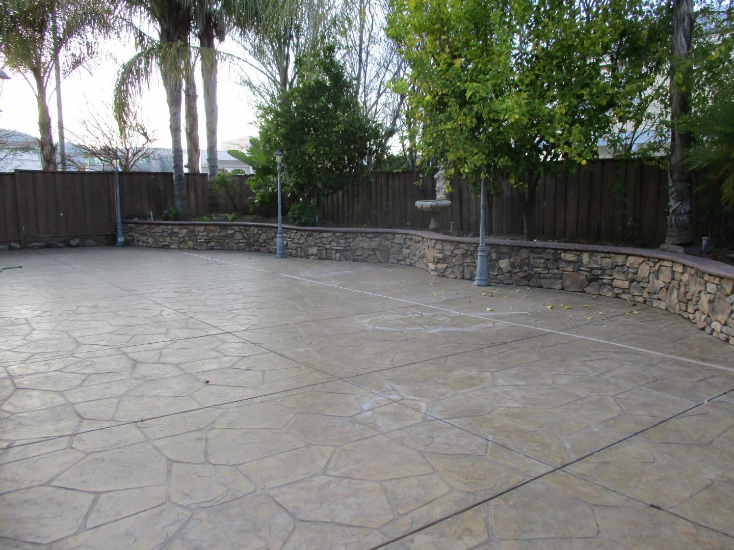 995 Brook Way Gilroy, CA 95020 - Photo 18 of 42 a view of backyard with potted plants and palm trees