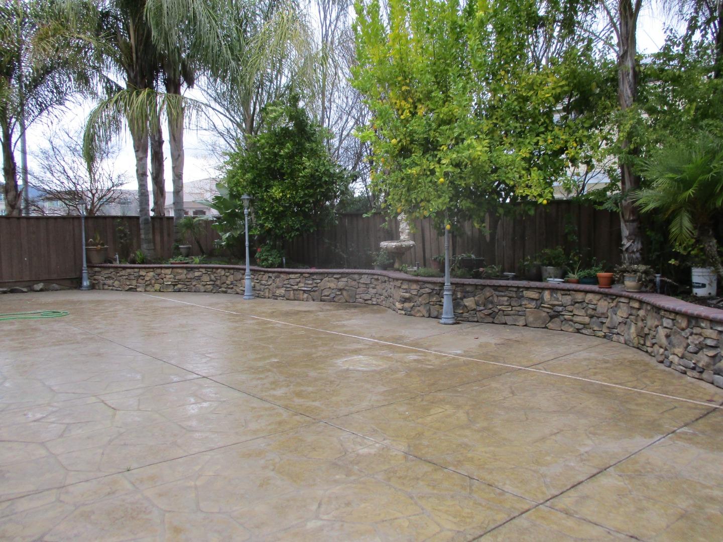 995 Brook Way Gilroy, CA 95020 - Photo 21 of 42 a backyard of a house with palm trees