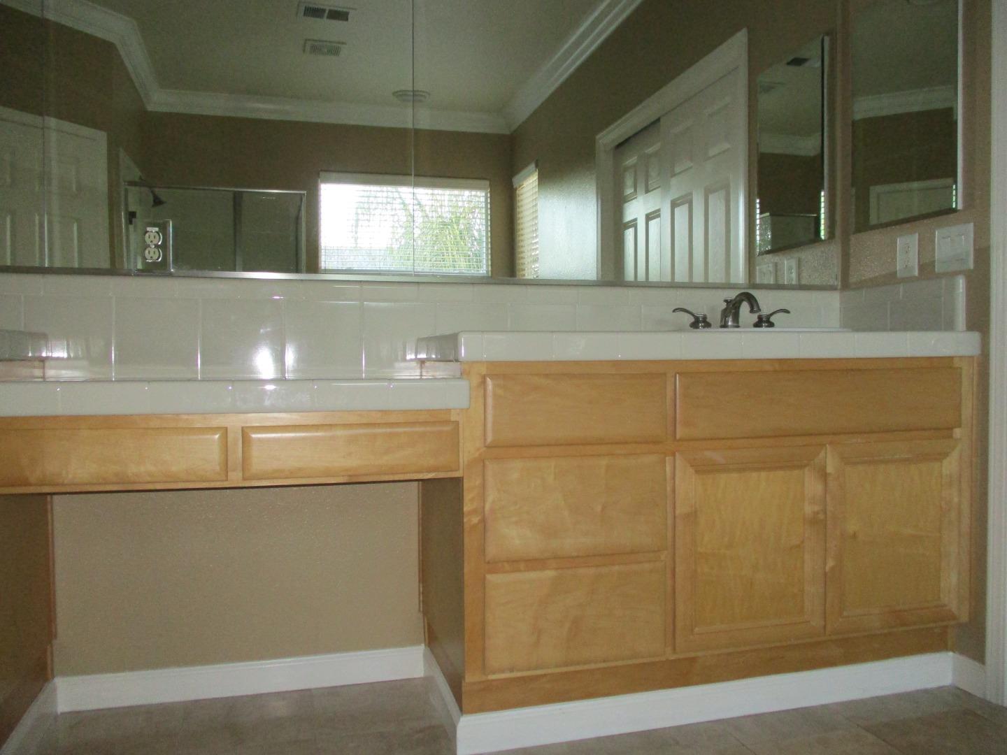 995 Brook Way Gilroy, CA 95020 - Photo 29 of 42 a bathroom with a sink and a mirror