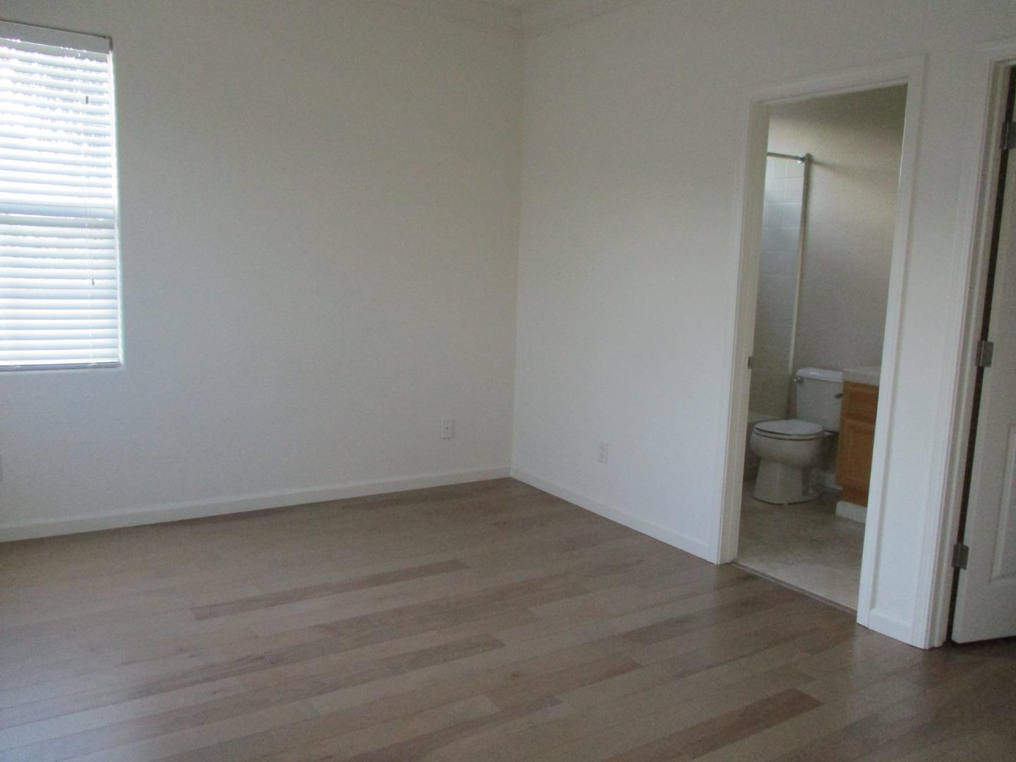 995 Brook Way Gilroy, CA 95020 - Photo 32 of 42 a view of a room with wooden floor and a hallway