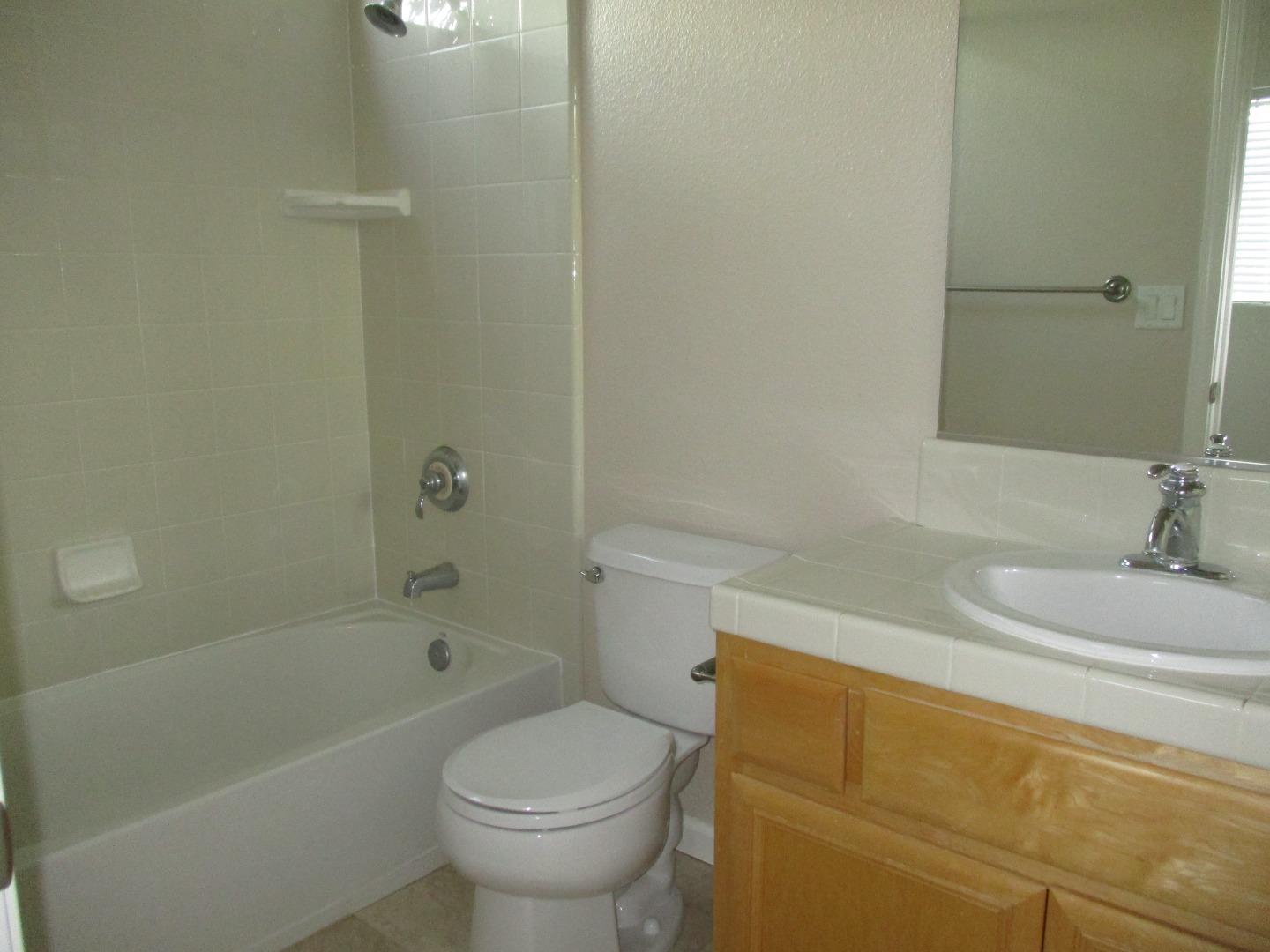 995 Brook Way Gilroy, CA 95020 - Photo 34 of 42 a bathroom with a sink and a toilet