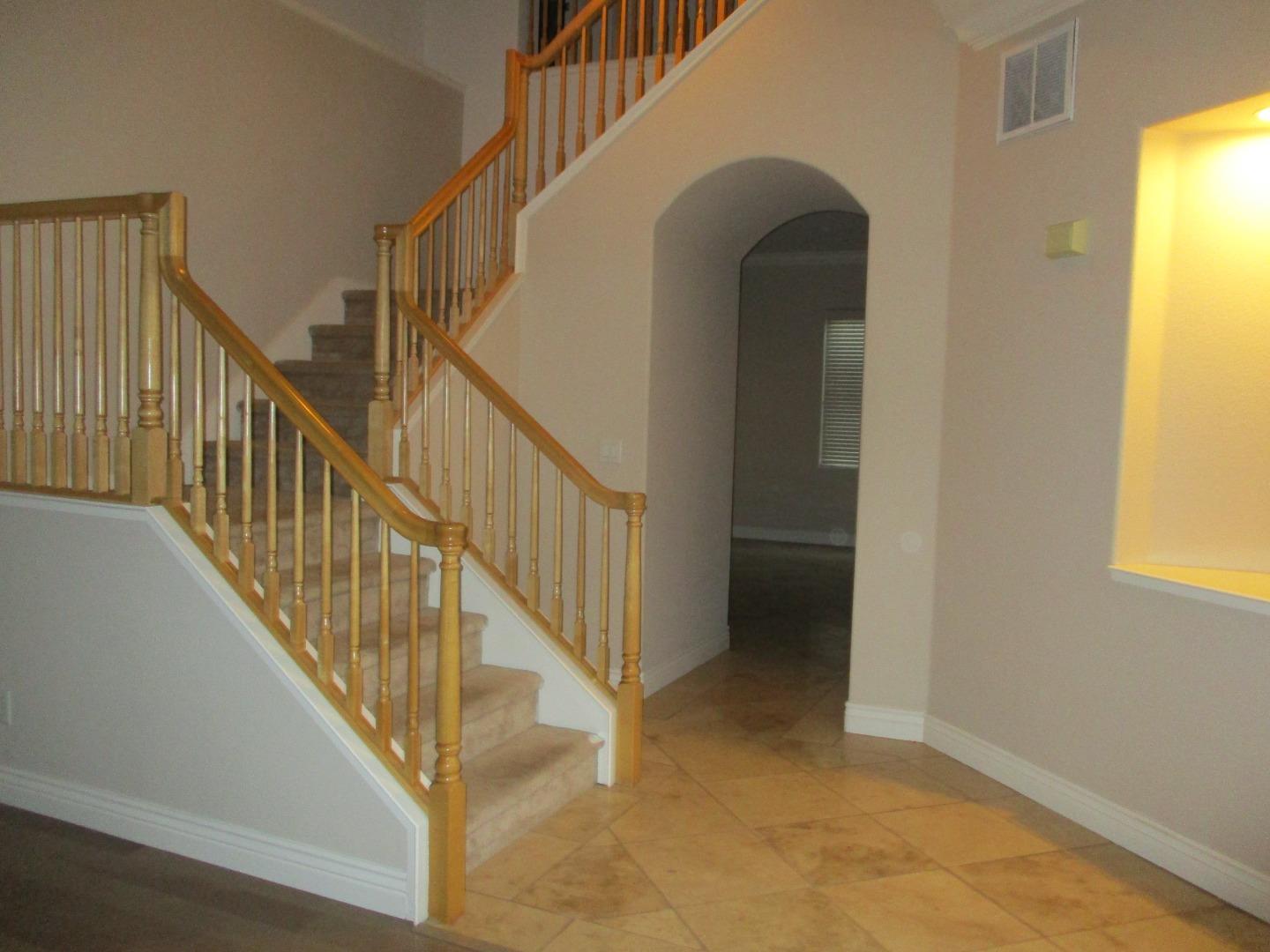 995 Brook Way Gilroy, CA 95020 - Photo 5 of 42 a view of staircase with railing and a window
