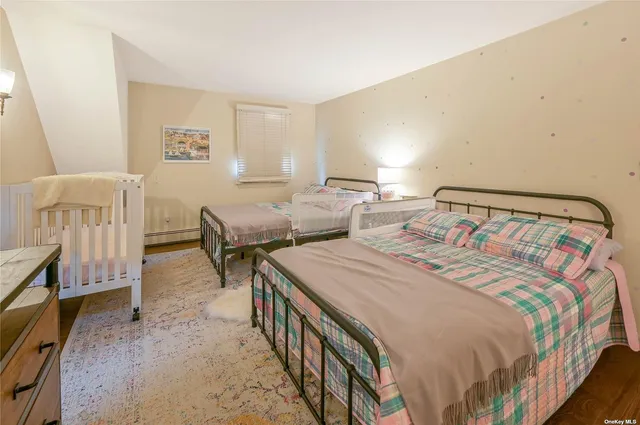 a bedroom with double bed and a window