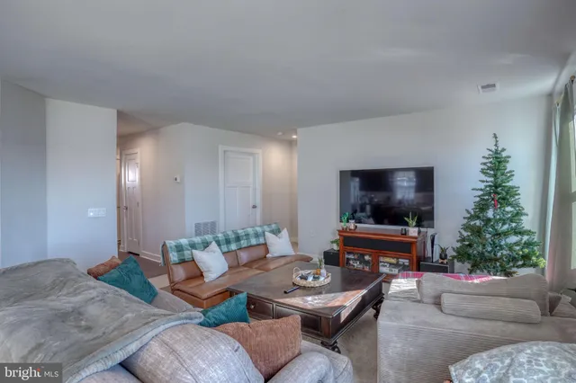 a kitchen with kitchen island a sink stove and refrigerator