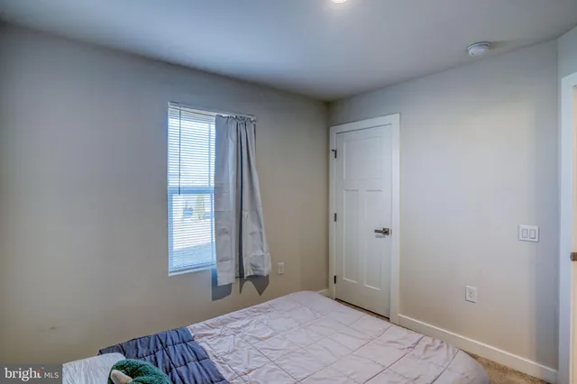 a view of storage and utility room with washer and dryer