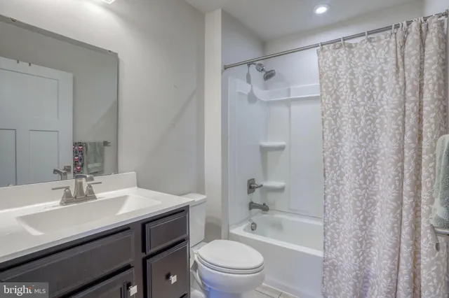 a bedroom with a bed and a table