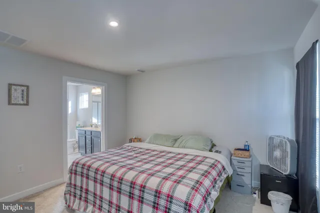 a bathroom with a sink double vanity and toilet