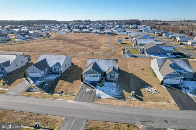 an aerial view of a house with a ocean view