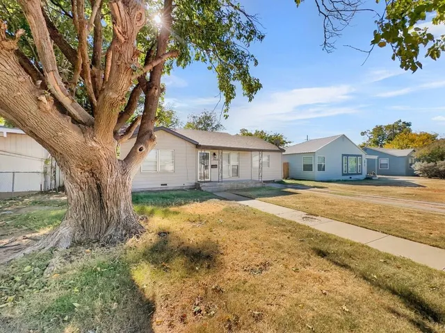 a house view with a trees