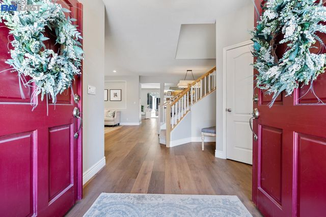 a view of entryway with wooden floor