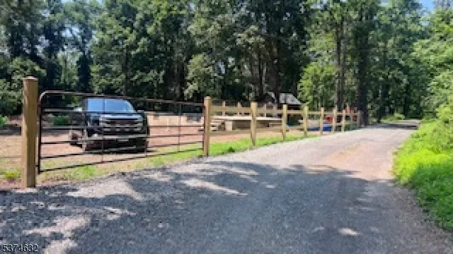 a view of a backyard with parked area