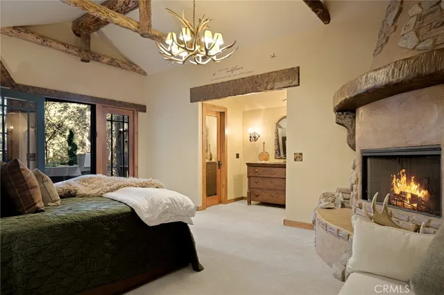 a bedroom with a bed and a fireplace
