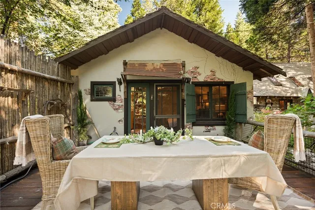 a view of a patio with table and chairs and potted plants