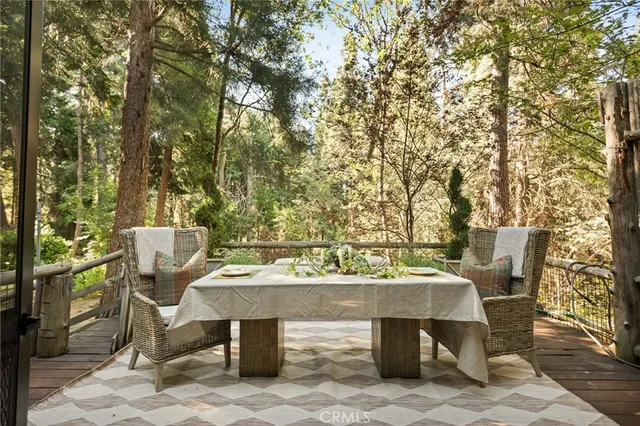 a view of a chairs and table in the patio