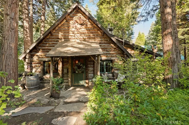 a view of a house with fountain bath and trees