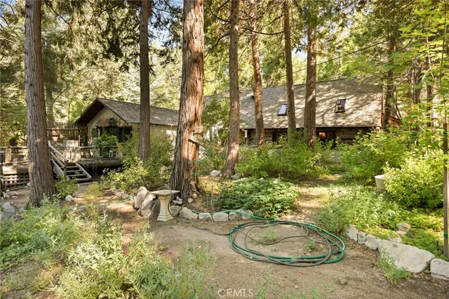 a backyard of a house with yard and outdoor seating