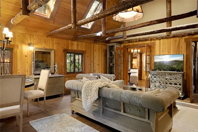 a bedroom with furniture and a large window