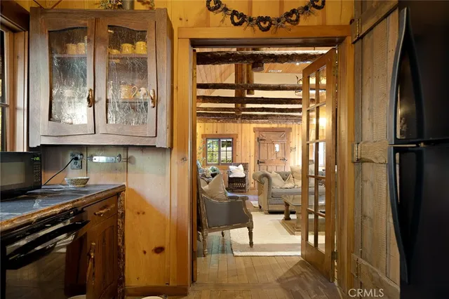 a view of a hallway with dining area and glass door