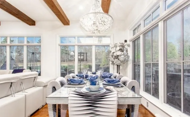 an aerial view of a house with a yard and lake view