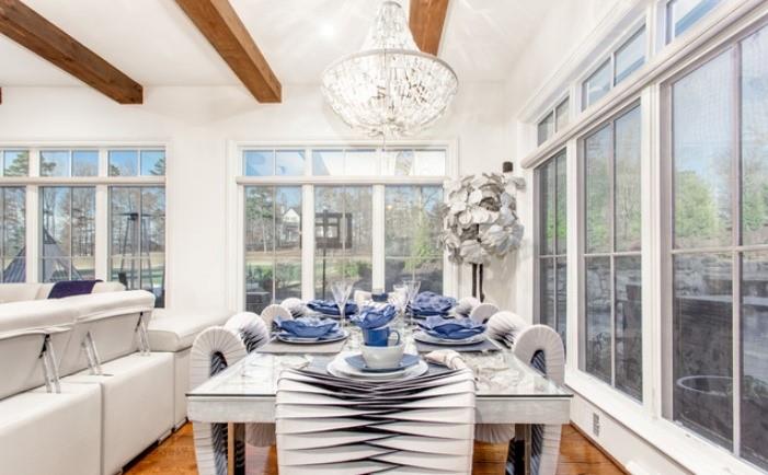 Undisclosed Address Milton, GA 30004 - Photo 14 of 118 a view of a dining room with furniture large windows and wooden floor