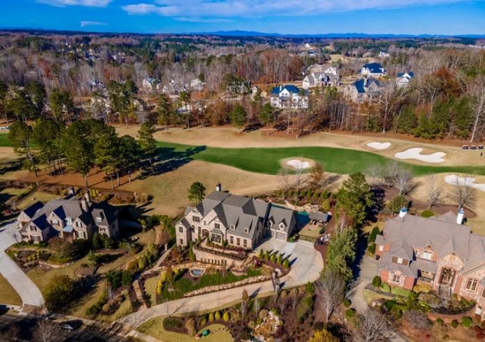 Undisclosed Address Milton, GA 30004 - Photo 21 of 118 an aerial view of a house with a yard and lake view