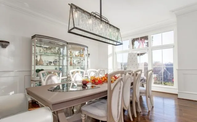 a view of a room that has a table and chairs