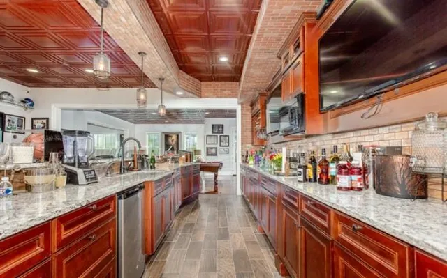 a bathroom with a double vanity sink a mirror and shower