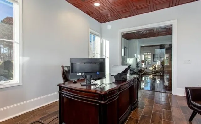 a living room with furniture fireplace and flat screen tv