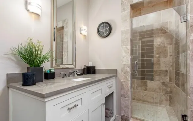a living room with furniture a pool table and a wooden floor