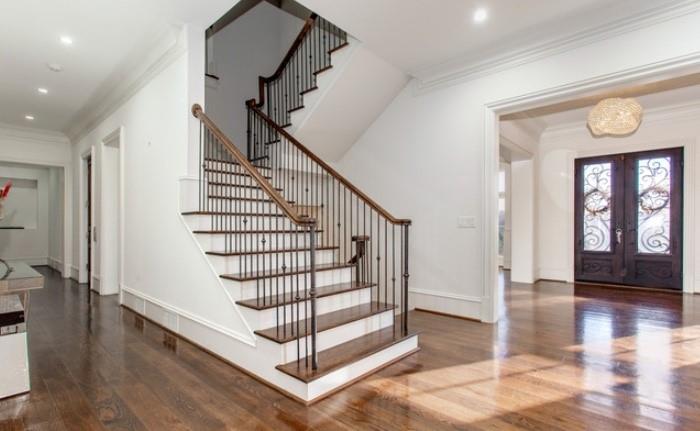 Undisclosed Address Milton, GA 30004 - Photo 58 of 118 a view of entryway with wooden floor and stairs