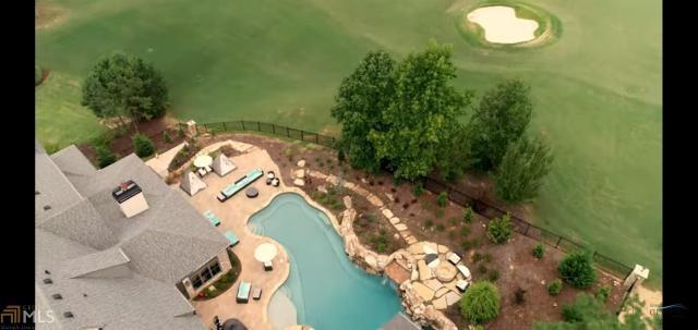 Undisclosed Address Milton, GA 30004 - Photo 65 of 118 an aerial view of a house with a swimming pool