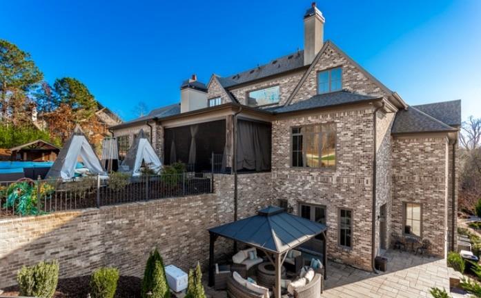 Undisclosed Address Milton, GA 30004 - Photo 8 of 118 a front view of a house with garden