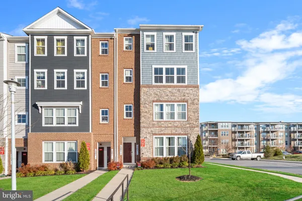 a front view of a building with a yard