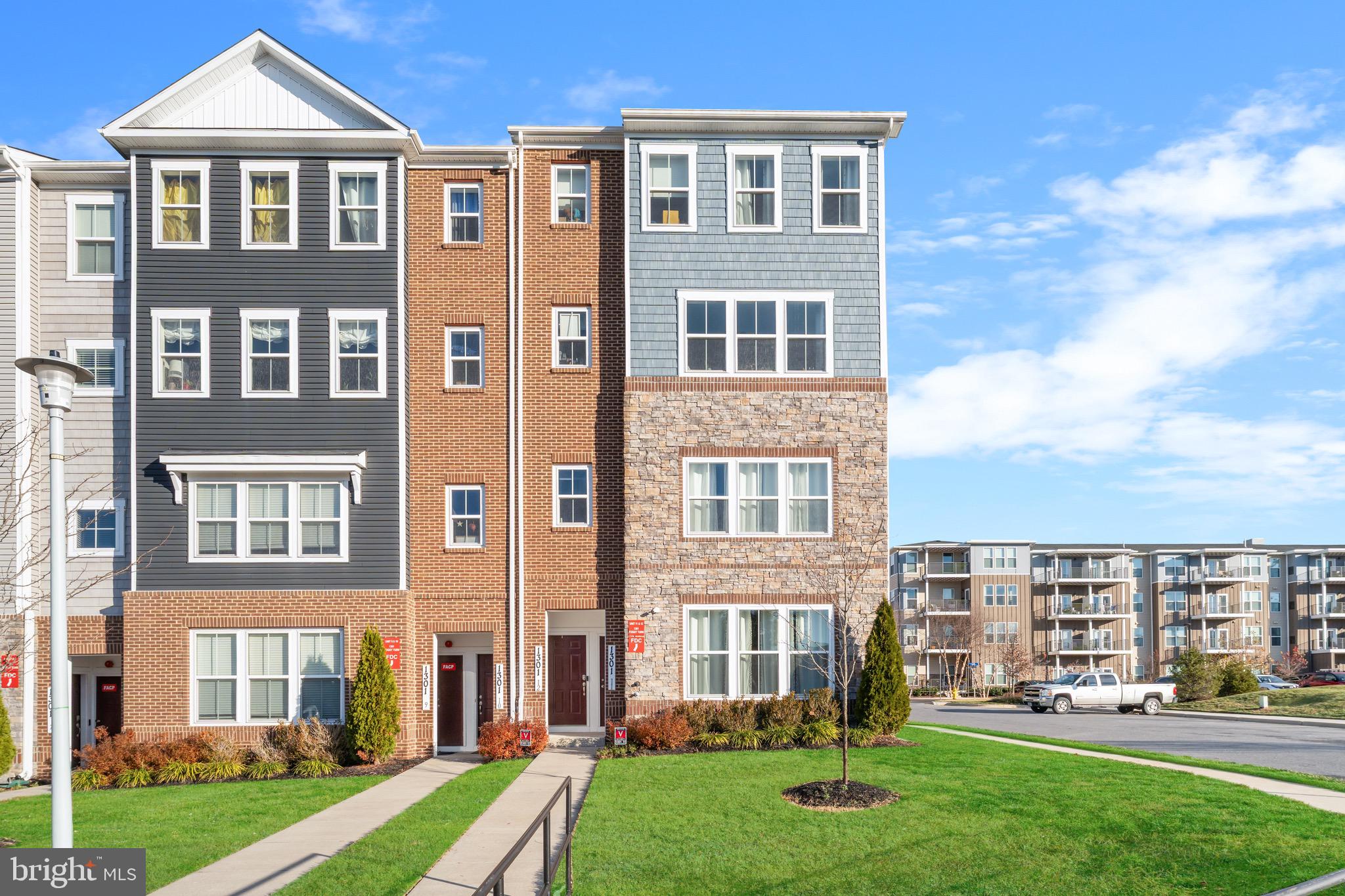 a front view of a building with a yard