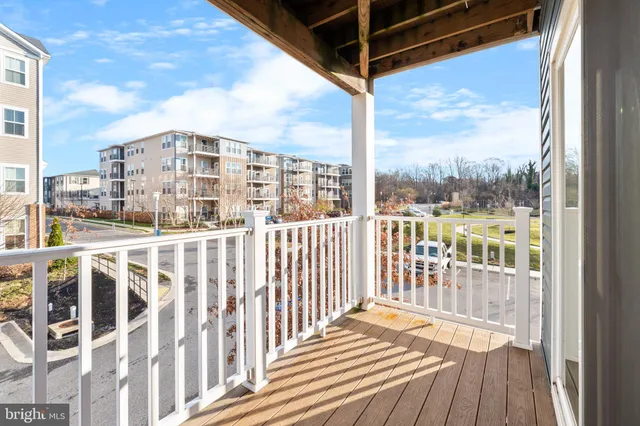a view of a balcony with wooden floor