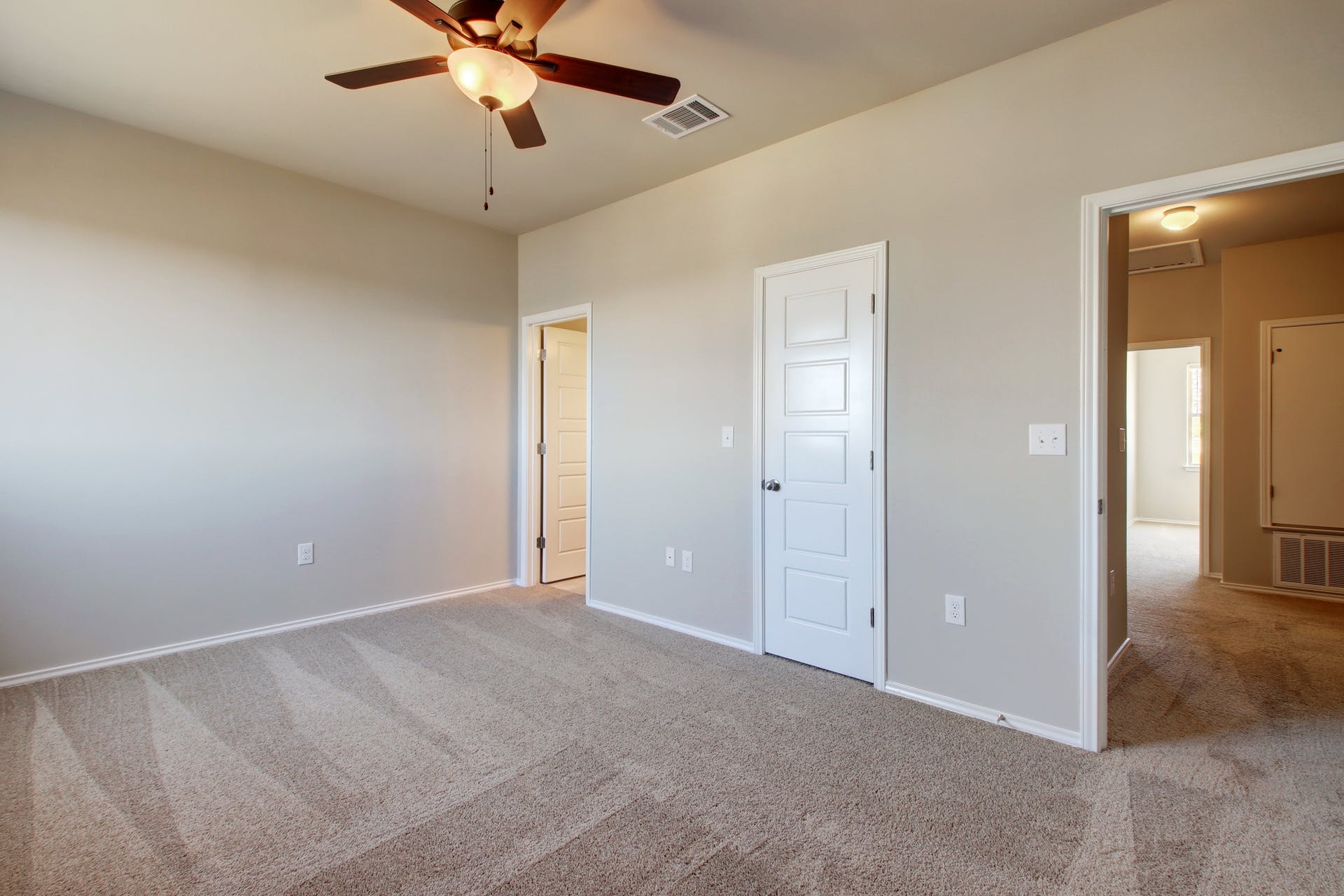1202 Garland Road Georgetown, TX 78626 - Photo 20 of 28 Spacious room featuring neutral carpet flooring, light gray wall paint, and a ceiling fan with integrated lighting