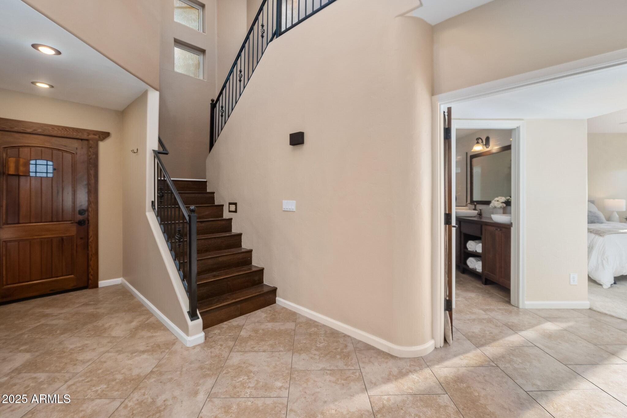 6547 North Turnberry Drive Tucson, AZ 85718 - Photo 17 of 51 a view of a hallway with entryway and stairs