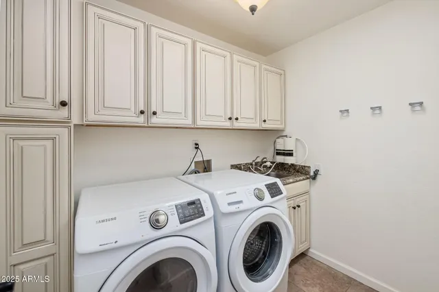 a spacious bathroom with a granite countertop sink and a mirror