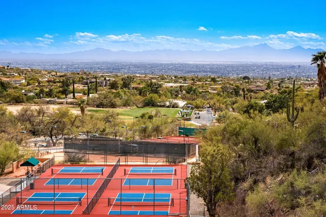 a view of a field with a big house