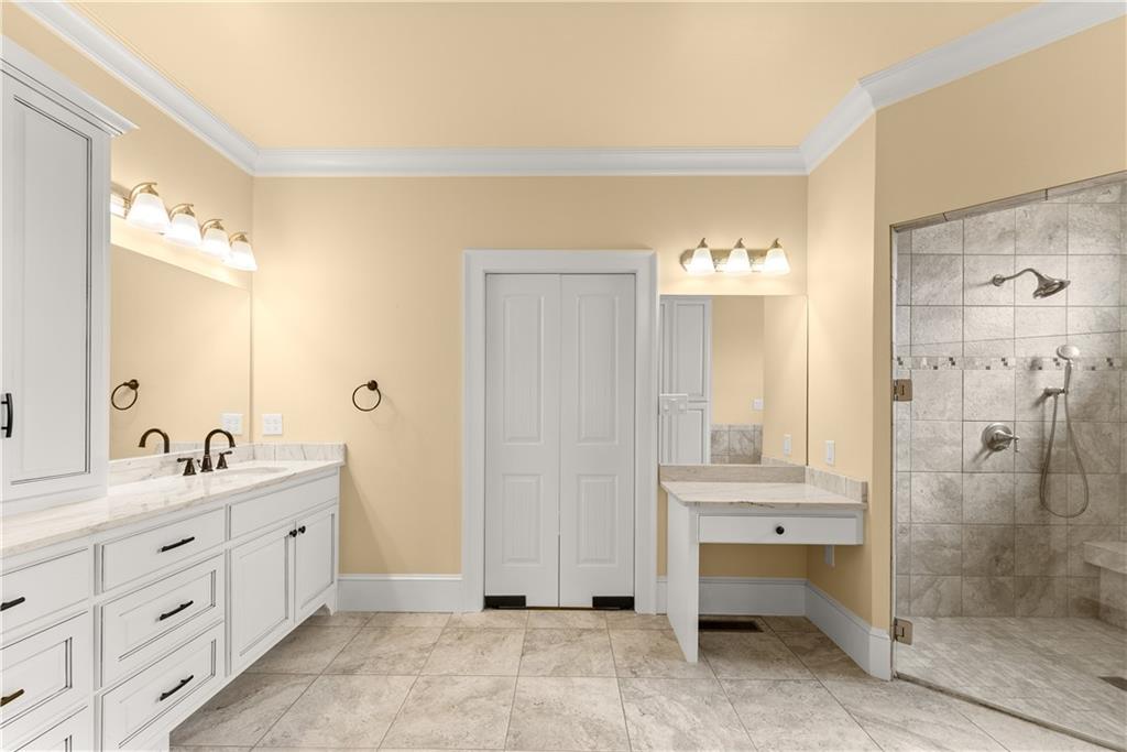725 County Farm Road Jefferson, GA 30549 - Photo 27 of 66 a spacious bathroom with a double vanity sink mirror and shower