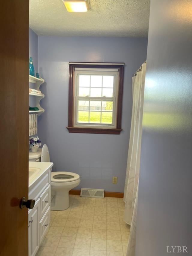2393 Grit Road Hurt, VA 24563 - Photo 13 of 22 a bathroom with a toilet